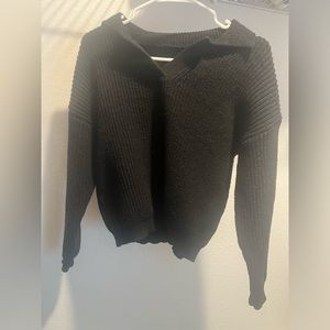 collared black sweater